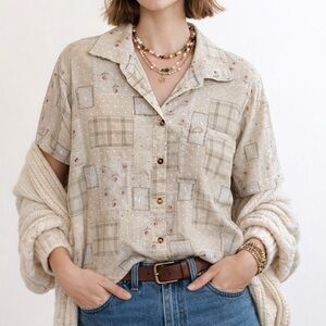 Beige Patterned button up shirt with paisley and floral patchwork design.